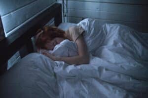 Woman having difficulty sleeping, a symptom of perimenopause